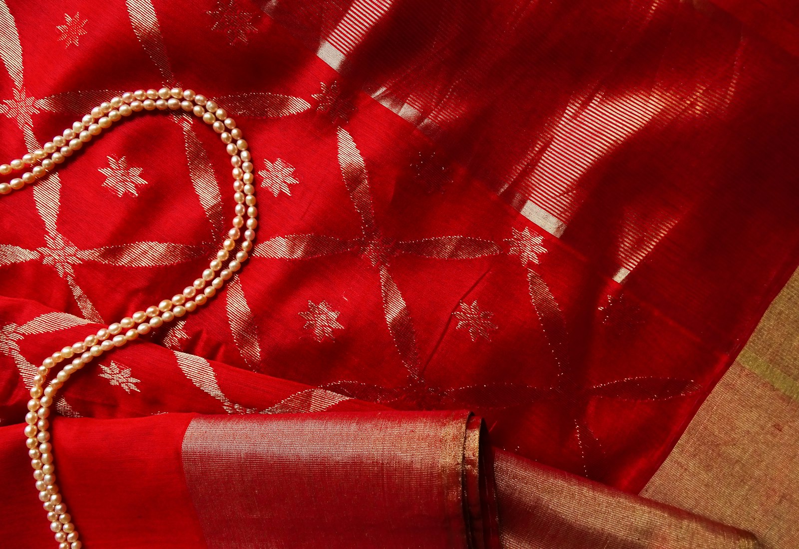 Handwoven red saree with gold zari detailing - Label by Natheera