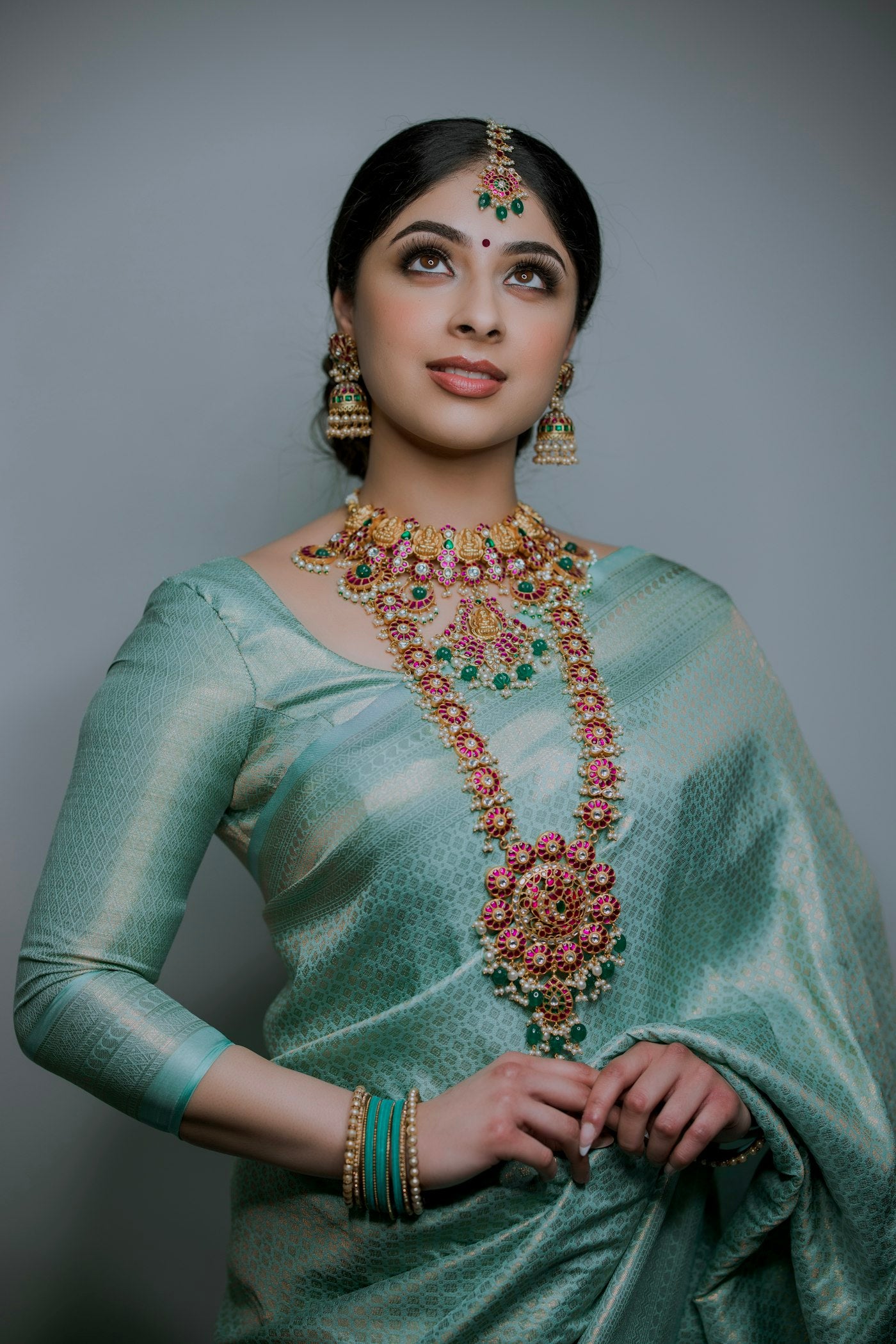 Elegant sage green silk saree with gold jewellery - Label by Natheera